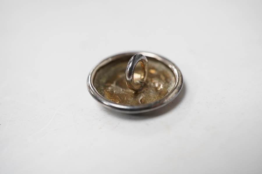 A cased set of six Edwardian small silver buttons, by Turner & Simpson, Chester, 1906, each embossed with the bust of a young lady, diameter 17mm.